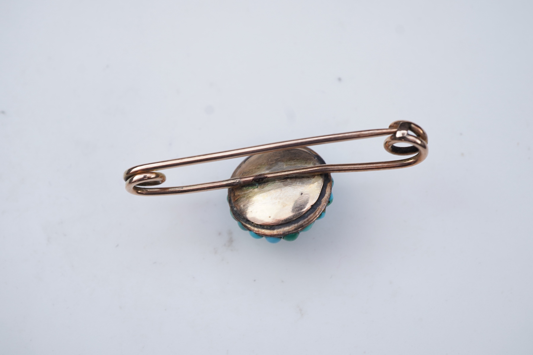Three rings and a brooch